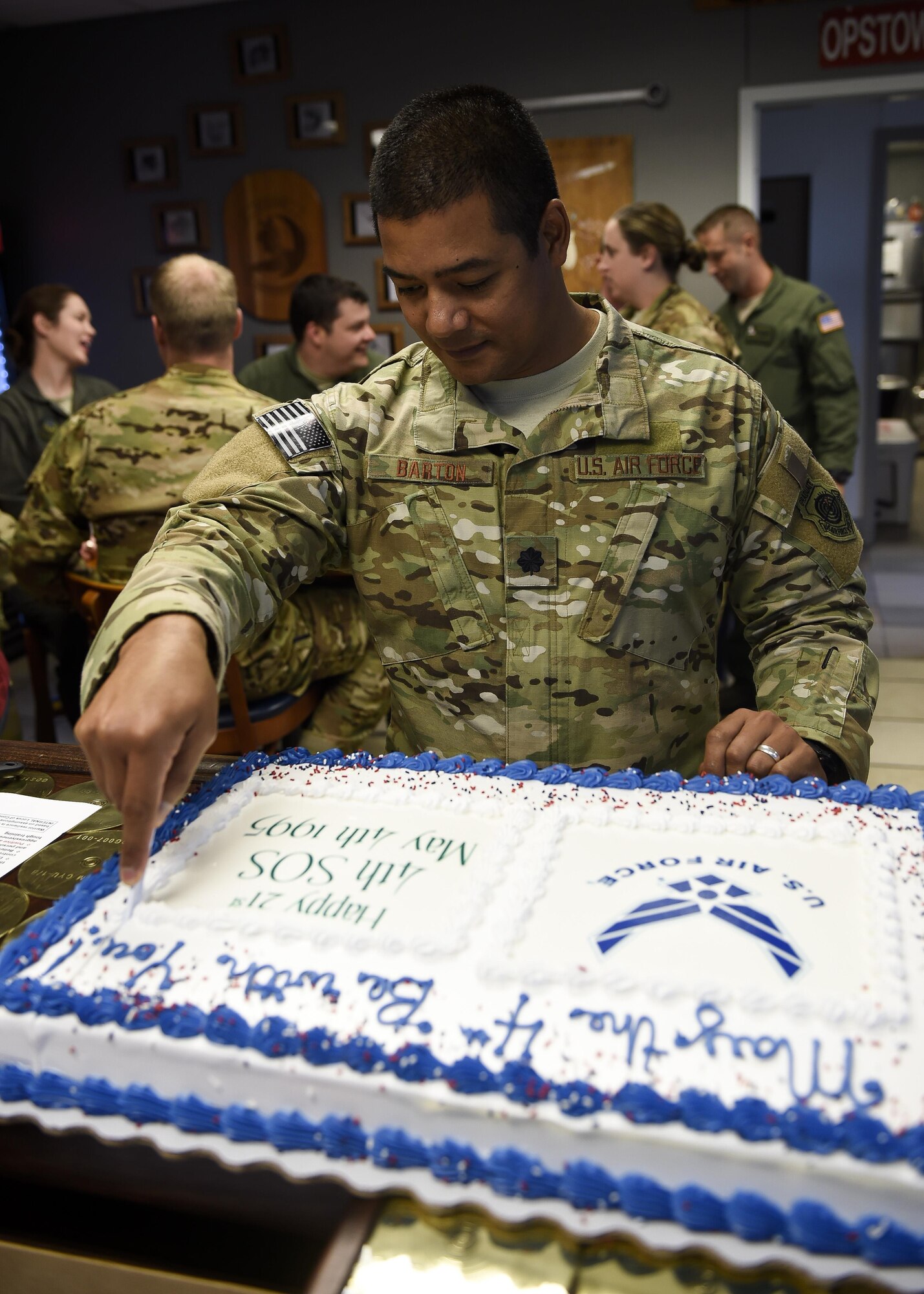 Lt. Col. Derrick Barton, the commander of the 4th Special Operations Squadron, cuts the squadron's birthday cake during a celebration at Hurlburt Field, Fla., May 4, 2016. The 4th SOS officially turned 21 on May 4th, although the squadron's history dates back to World War II and the 4th Air Corps Ferrying Squadron. (U.S. Air Force photo by Airman 1st Class Kai White)