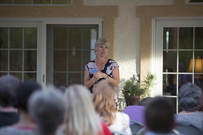Cherie Lewis, president, Officers’ Spouses’ Club, congradulates the scholarship and grant award recipients during the annual OSC Scholarship and Grant Awards Reception at Quarters One May 3, 2016. (Official Marine Corps Photo by Cpl. Julio McGraw/Released)