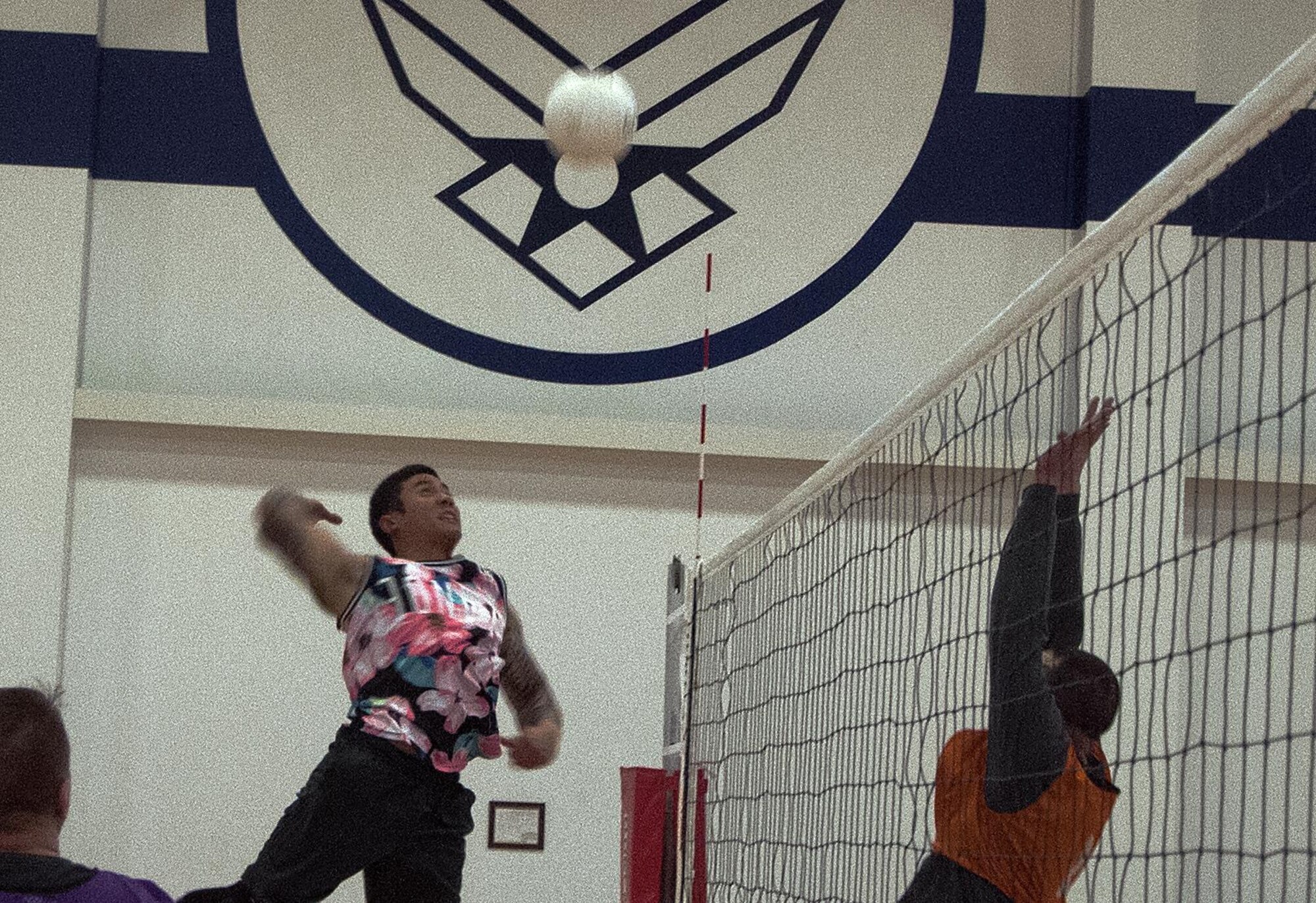 Bryan Savella, 90th Security Forces Squadron intramural volleyball team member, jumps up to spike a volleyball during an intramural volleyball semi-finals match May 4, 2016, inside the Freedom Hall Fitness Center on F.E. Warren Air Force Base, Wyo. The team beat the 90th Medical Group 15 to 11 points in the final match to claim victory. (U.S. Air Force photo by Senior Airman Brandon Valle)