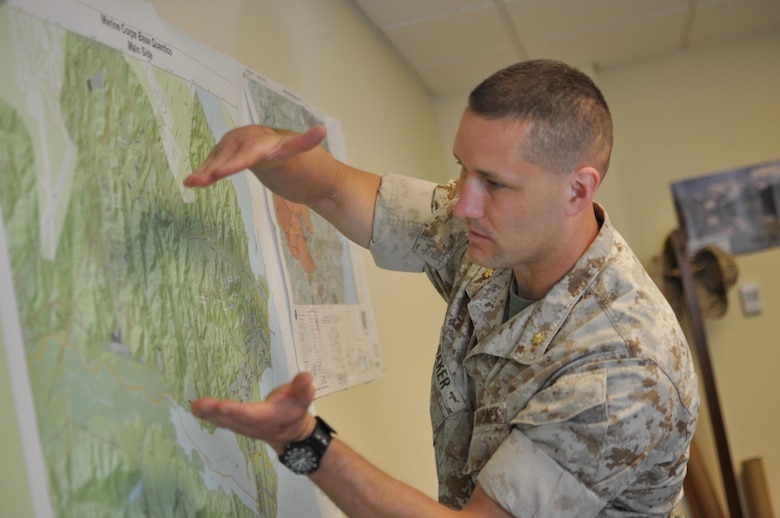 Maj. Peter Baker, deputy director for Natural Resources and Environmental Affairs branch (NREA), shows the recreational trails on the Mainside of Marine Corps Base Quantico.