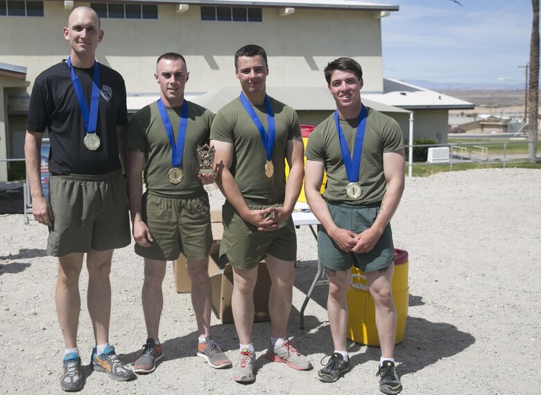 3rd Light Armored Reconnaissance Battalion team displays the first place trophy and medals at the conclusion of the Amazing Sexual Assault Prevention and Response Race held aboard the Combat Center April 29, 2016. (Official Marine Corps photo by Cpl. Thomas Mudd/Released)