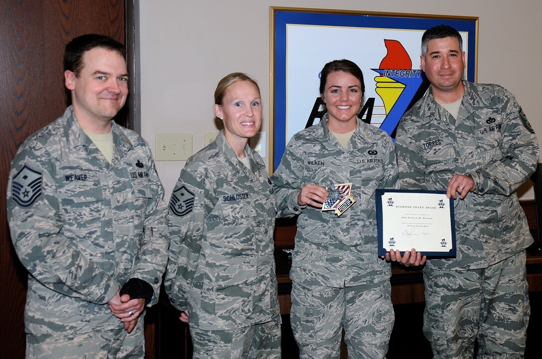 Senior Airman Karlyn Wilken, 14th Operations Support Squadron and currently serving as the 14th Flying Training Wing command chief executive assistant, earns the first quarter Diamond Sharp Award April 28 at Columbus Air force Base, Mississippi. The Diamond Sharp Award is a recognition program run by the Columbus Air Force Base first sergeants recognizing an Airman or a team of Airmen on a quarterly basis. (U.S. Air Force photo/Sharon Ybarra)
