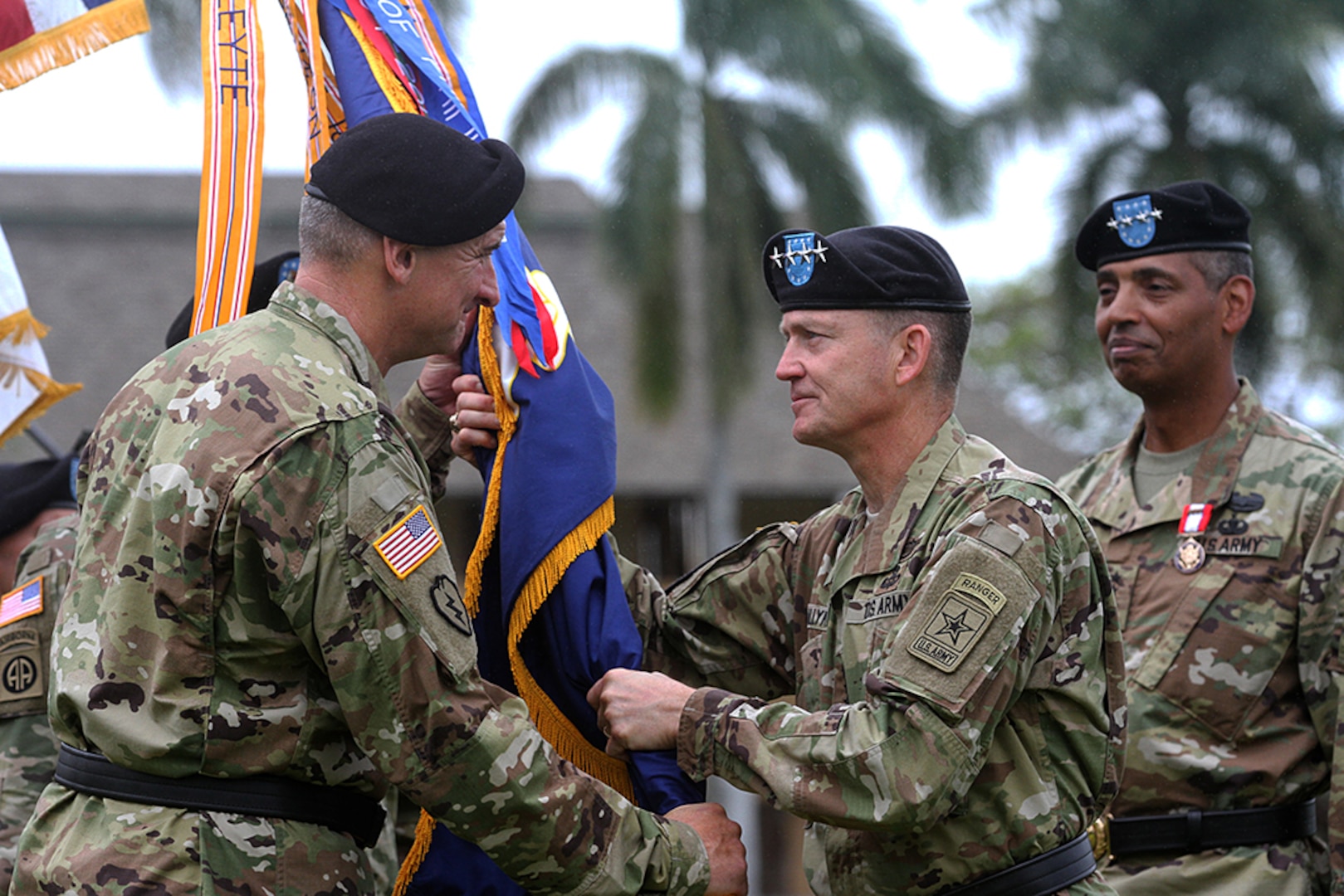 Gen. Robert B. Brown, in-coming U.S. Army Pacific commanding general receives the USARPAC colors from Vice Chief of Staff of the Army, Gen. Daniel B. Allyn, during a change of command ceremony held at historic Palm Circle, Fort Shafter, Hawaii, May 4. While Gen. Brown receiving the colors signifies his assuming command of the “One Team” ohana. 