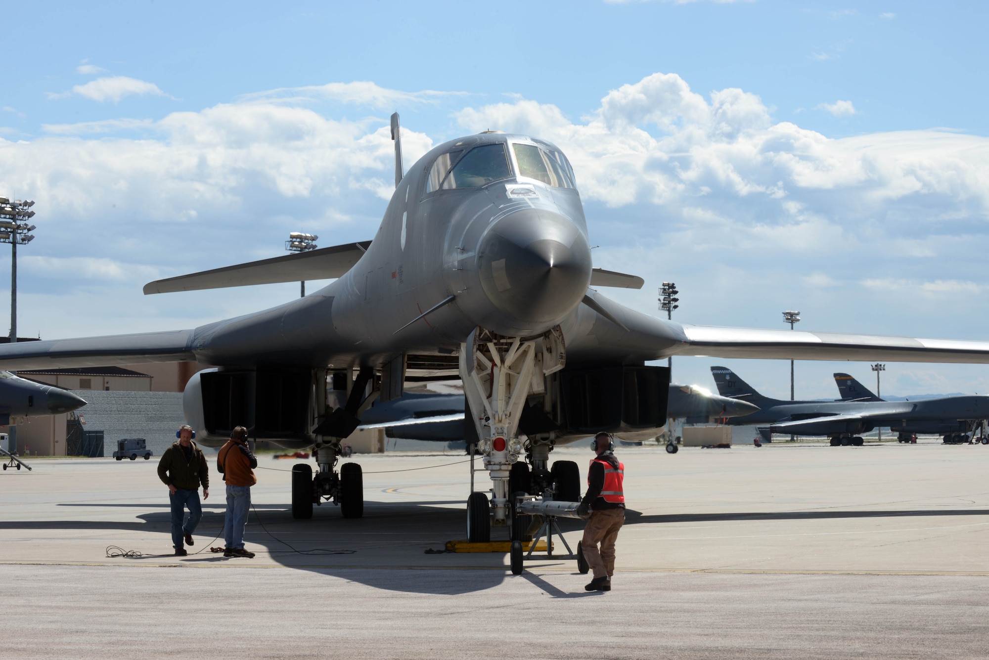 M-1 Support Services contractors perform post-flight inspections on the first upgraded Sustainment Block-16 B-1 bomber at Ellsworth Air Force Base, S.D., May 2, 2016. This B-1 is the first of Ellsworth’s fleet to receive the upgrade which includes updating analog cockpit displays and connecting the aircraft to a global communications network. (U.S. Air Force photo by Airman Donald Knechtel/Released)
