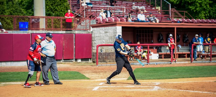 Senior Airman Jason Treffry, 628th Air Base Wing public affairs broadcaster, hits a softball while playing against the Wounded Warrior Amputee Softball Team April 23, 2016, at Patriot’s Point in Charleston, S.C. The WWAST is comprised of veterans and active-duty service members who have lost limbs but won’t let that disability to keep them from being competitive in athletics. They travel the country and play able-bodied softball teams competitively or through exhibition and celebrity games. (U.S. Air Force photo/Senior Airman Clayton Cupit)