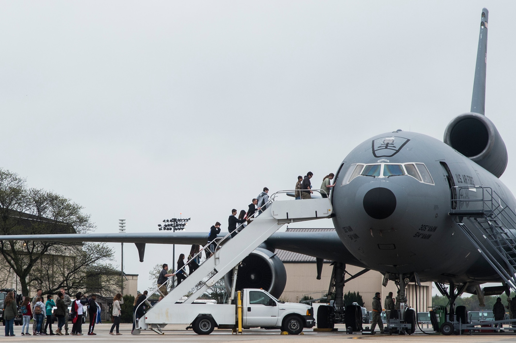 Local high school students board a U.S. Air Force KC-10 Extender during the Military Science, Technology, Engineering, and Mathematics Expo at Joint Base McGuire-Dix-Lakehurst, N.J., May 3, 2016. The event showcased the technology and capabilities of the Joint Base and included briefings from Air Force, Army and Navy personnel. (U.S. Air Force photo by Tech. Sgt. Gustavo Gonzalez/Released)