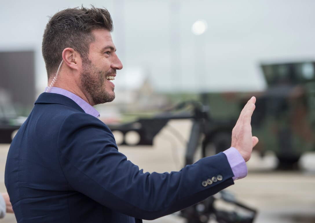 Jesse Palmer, correspondent with ABC’s Good Morning America, greets a crowd of U.S. Airmen at Langley Air Force Base, Va., May 4, 2016. During his visit to Langley, Palmer toured an intelligence unit, received a flight in an F-16 Fighting Falcon and did a live broadcast from the flight line. (U.S. Air Force photo by Senior Airman Kayla Newman)