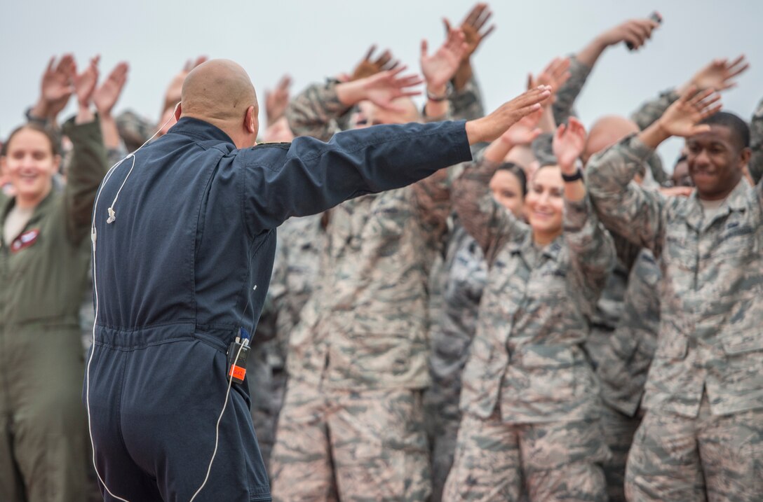 U.S. Air Force Tech. Sgt. Richard Vasquez Jr., vocalist for Full Spectrum, sings in front of U.S. Airmen at Langley Air Force Base, Va., May 4, 2016. Full Spectrum performed for the crowd as part of a special Good Morning America broadcast at the installation. (U.S. Air Force photo by Senior Airman Kayla Newman)