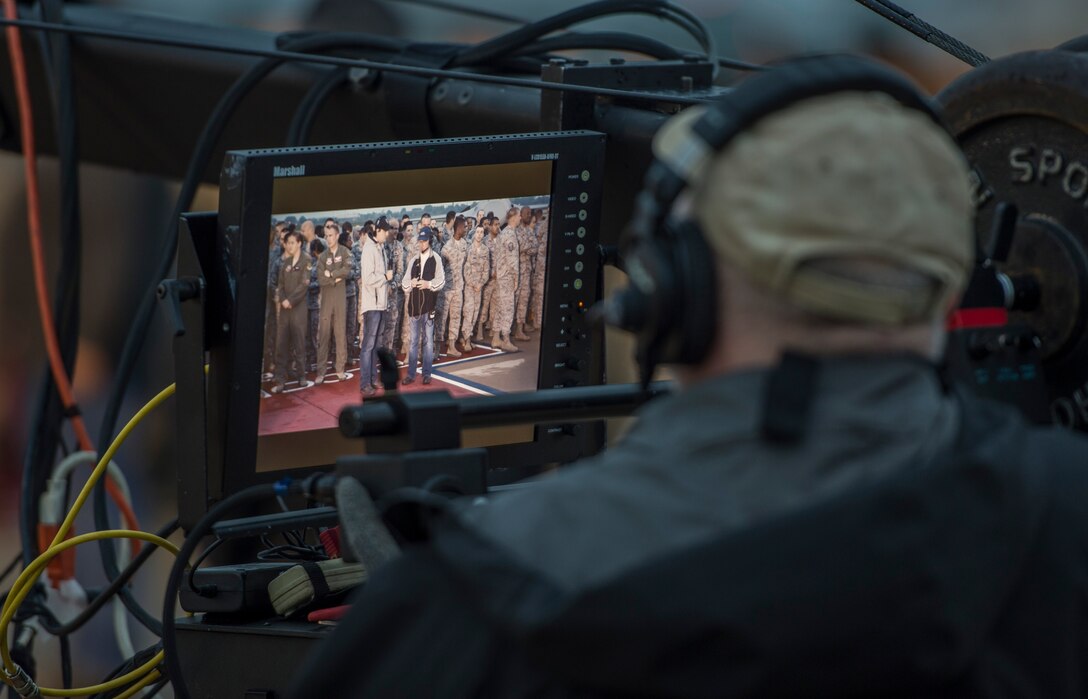 A television crew member from ABC’s Good Morning America prepares for the broadcast at Langley Air Force Base, Va., May 4, 2016. Good Morning America did a live broadcast from the flight line to commemorate the 100 years of Langley. (U.S. Air Force photo by Senior Airman Kayla Newman)