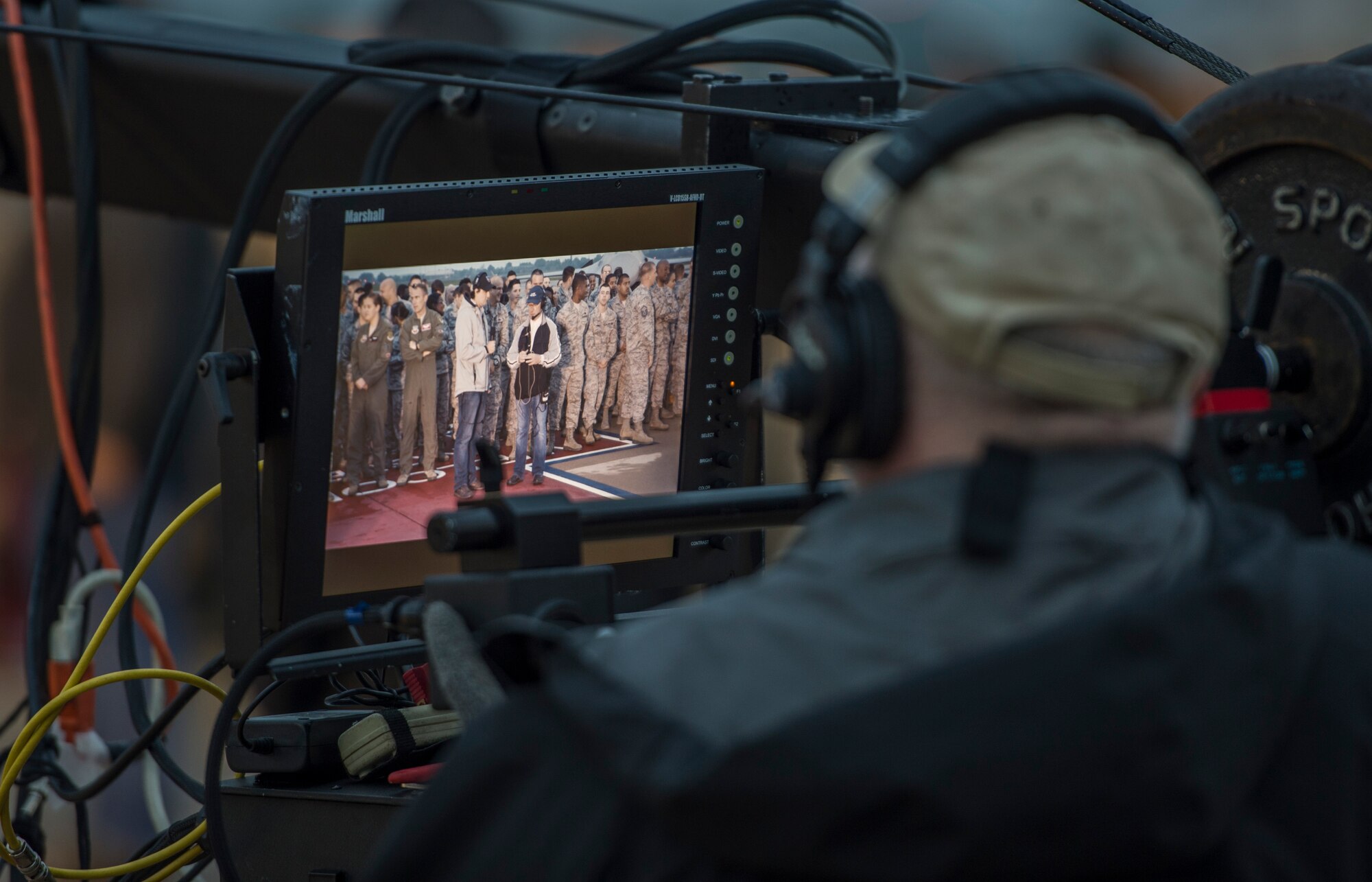 A television crew member from ABC’s Good Morning America prepares for the broadcast at Langley Air Force Base, Va., May 4, 2016. Good Morning America did a live broadcast from the flight line to commemorate the 100 years of Langley. (U.S. Air Force photo by Senior Airman Kayla Newman)