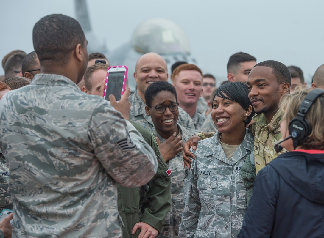 Anthony Mackie, actor, poses for pictures with U.S. Airmen at Langley Air Force Base, Va., May 4, 2016. Mackie surprised the Airmen during a live Good Morning America broadcast from Langley. (U.S. Air Force photo by Senior Airman Kayla Newman)