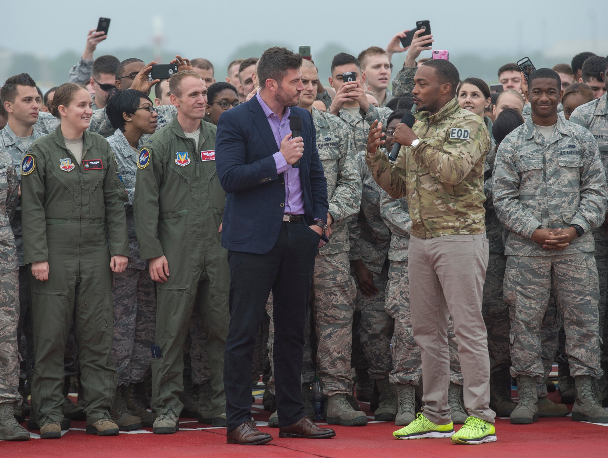 Jesse Palmer, correspondent with ABC’s Good Morning America, and Anthony Mackie, actor, do a live broadcast from Langley Air Force Base, Va., May 4, 2016. Mackie plays Falcon in the movie, Captain America: Civil War. (U.S. Air Force photo by Senior Airman Kayla Newman)
