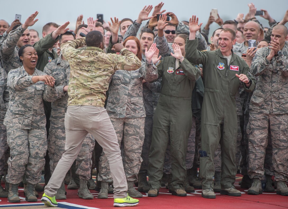 Anthony Mackie, actor, high-fives U.S. Air Force Airmen at Langley Air Force Base, Va., May 4, 2016. Mackie surprised the Airmen on live television as part of ABC’s Good Morning America broadcast from the installation. (U.S. Air Force photo by Senior Airman Kayla Newman)