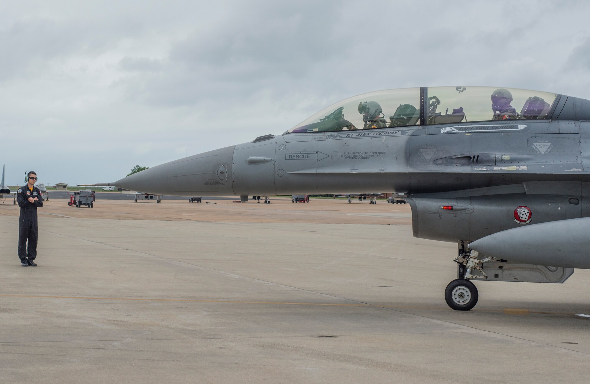 U.S. Air Force Capt. Michael Watts, F-16 Fighting Falcon pilot, and Jesse Palmer, correspondent for ABC’s Good Morning America, prepare of takeoff at Langley Air Force Base, Va., May 3, 2016. In the air, Watts and Palmer performed three 360-degree aileron rolls, while pulling up to 7.7 G’s. (U.S. Air Force photo by Senior Airman Kayla Newman)