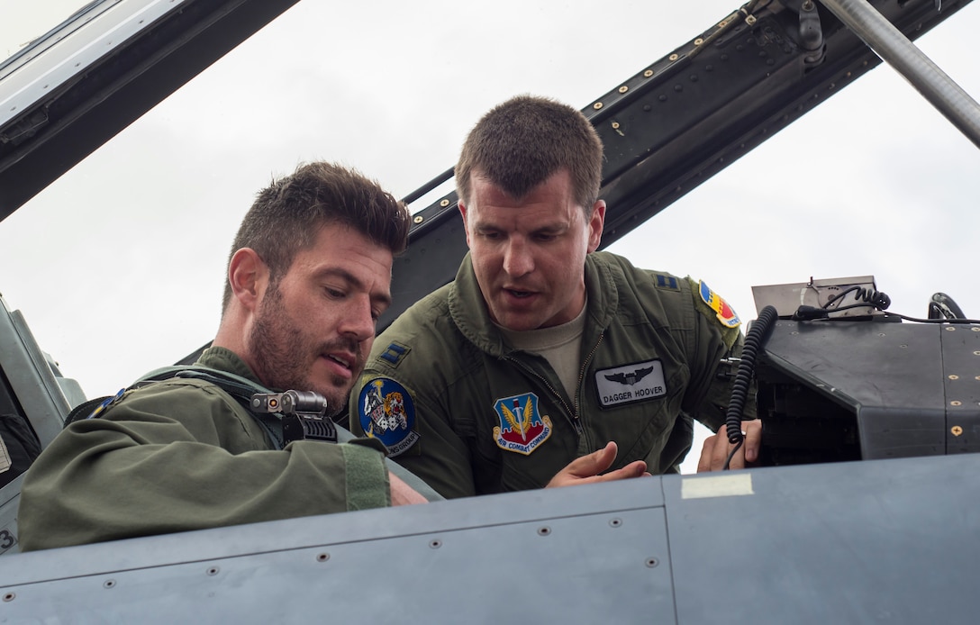 U.S. Air Force Capt. Jesse Hoover F-16 Fighting Falcon pilot, gets Jesse Palmer, correspondent for ABC’s Good Morning America, adjusted in his seat in the F-16 prior to his flight at Langley Air Force Base, Va., May 3, 2016. Palmer’s pilot was Capt. Michael Watts, from Shaw Air Force Base, S.C. (U.S. Air Force photo by Senior Airman Kayla Newman)