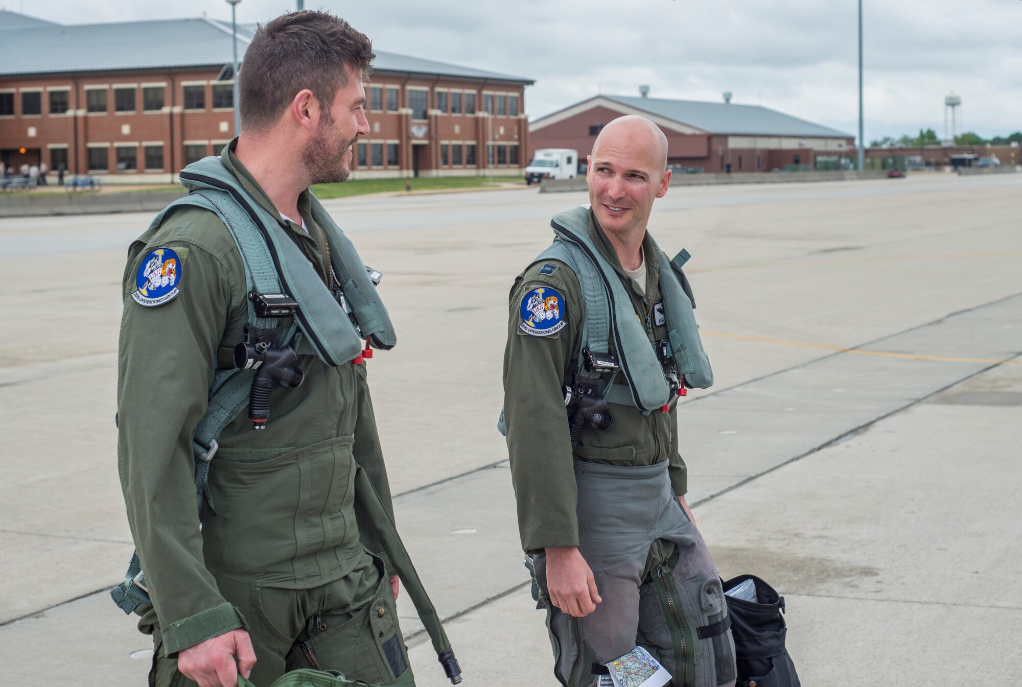 U.S. Air Force Capt. Michael Watts, F-16 Fighting Falcon pilot, and Jesse Palmer, correspondent for ABC’s Good Morning America, walk to the F-16  they will be flying in at Langley Air Force Base, Va., May 3, 2016. Watts, stationed at Shaw Air Force Base, S.C., came to Langley to give Palmer his first ride in a fighter jet. (U.S. Air Force photo by Senior Airman Kayla Newman)