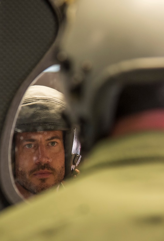 Jesse Palmer, correspondent for ABC’s Good Morning America, tries on his helmet during his flight equipment fitting at Langley Air Force Base, Va., May 3, 2016. The fittings ensure that all equipment is the appropriate fit, free of any discrepancies and comfortable for the flier. (U.S. Air Force photo by Senior Airman Kayla Newman)