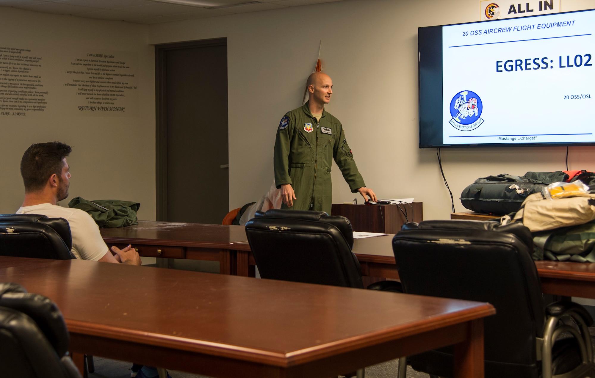 U.S. Air Force Capt. Michael Watts, F-16 Fighting Falcon pilot, teaches Egress training to Jesse Palmer, correspondent for ABC’s Good Morning America, during his visit at Langley Air Force Base, Va., May 3, 2016. Egress training was one portion of flight trainings that Palmer had to attend in order to fly in the F-16. (U.S. Air Force photo by Senior Airman Kayla Newman)