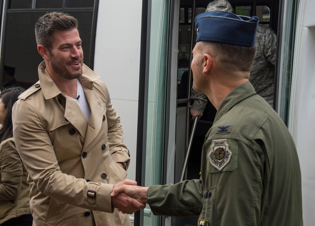 U.S. Air Force Col. Pete Fesler, commander of the 1st Fighter Wing, greets Jesse Palmer, correspondent for ABC’s Good Morning America, during his visit at Langley Air Force Base, Va., May 3, 2016. Palmer and a GMA television crew received a tour of the installation before Palmer received a ride in an F-16 Fighting Falcon. (U.S. Air Force photo by Senior Airman Kayla Newman)