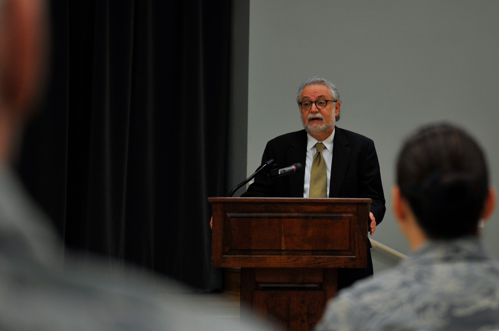 Garrick Feldman, publisher of the Combat Airlifter base newspaper, shares his mother's story of being a Holocaust survivor May 5, 2016, at Little Rock Air Force Base. Feldman spoke on his mother’s behalf in hopes that she and those who survived are never forgotten. (U.S. Air Force photo by Kevin E. Sommer Giron)