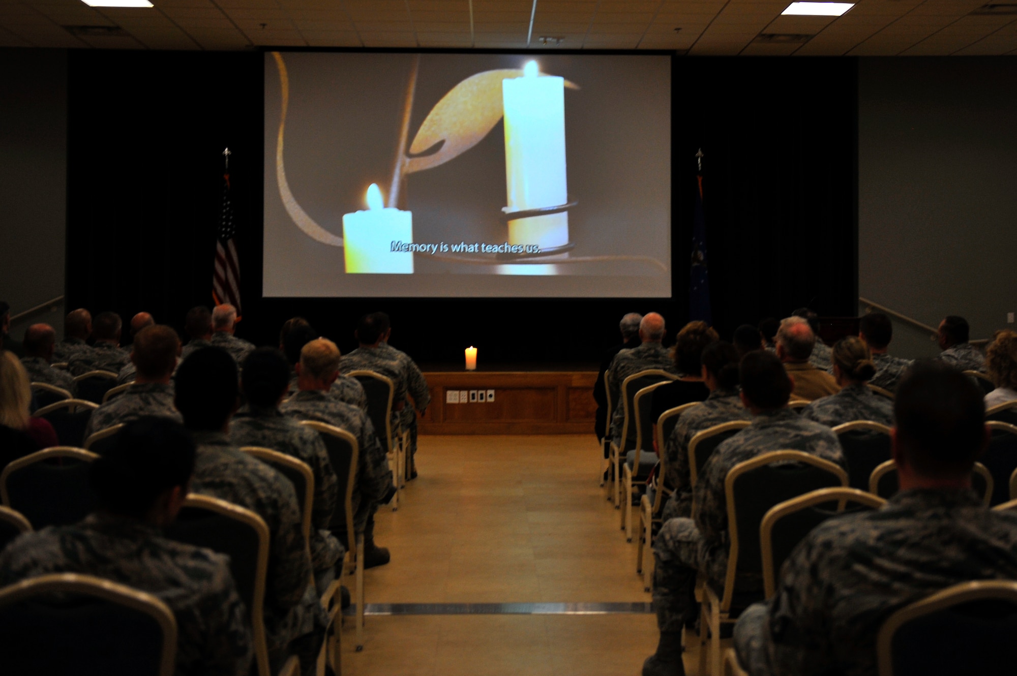 Service members watch a Holocaust remembrance video, May 5, 2016, at Little Rock Air Force Base. The Holocaust began in 1933 when Adolf Hitler came to power in Germany and ended in 1945 when the Nazi regime was defeated by the Allied powers (U.S. Air Force photo by Kevin E. Sommer Giron)