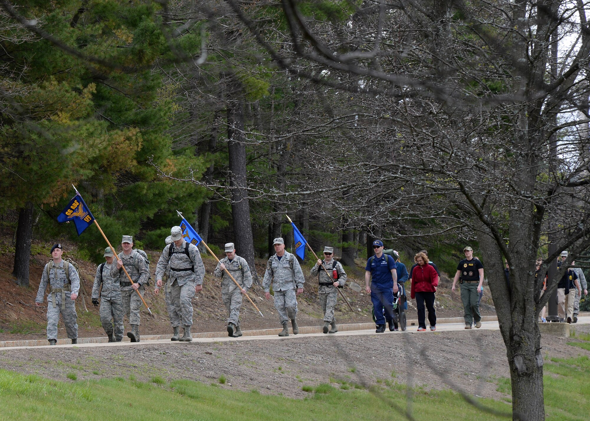 Members of the Hanscom community participate in a Air Force Office of Special Investigations Memorial March on base April 29. The march was held to remember six agents who died Dec. 21 of wounds sustained when their patrol was attacked by a suicide bomber on a motorcycle near Bagram Air Base in Afghanistan.  (U.S. Air Force photo by Linda LaBonte Britt)
