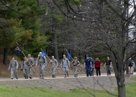 Members of the Hanscom community participate in a Air Force Office of Special Investigations Memorial March on base April 29. The march was held to remember six agents who died Dec. 21 of wounds sustained when their patrol was attacked by a suicide bomber on a motorcycle near Bagram Air Base in Afghanistan.  (U.S. Air Force photo by Linda LaBonte Britt)