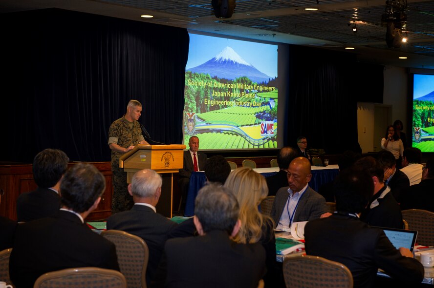 Col. Chris Michelsen, United States Forces, Japan, director of logistics and installations, speaks before Industry Day participants at Yokota Air Base, Japan, April 28, 2016. The event, led by the 374th Civil Engineer Squadron, 374th Contracting Squadron, USFJ and the Society of American Military Engineers, was an opportunity for U.S. government organizations to build partnerships with industries from throughout Japan in the wave of new construction projects throughout the region. (U.S. Air Force photo by Senior Airman Delano Scott/Released)
