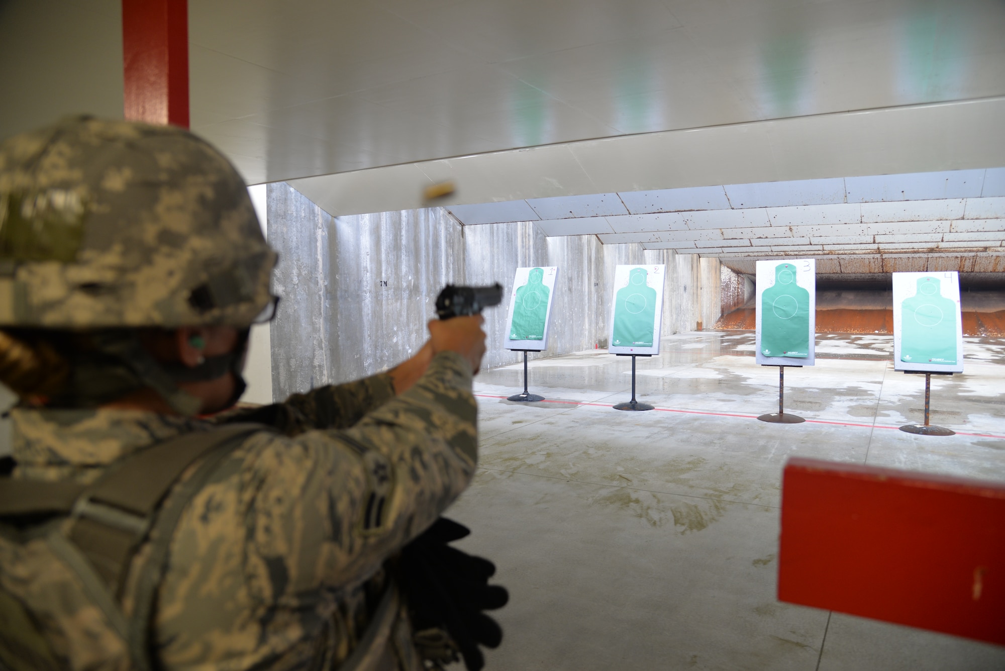 U.S Air Force Airman 1st Class Jasmin Amaral, 18th Security Forces Squadron patrolman, fires her M9 pistol during a qualification course at the combat arms training and maintenance facility April 28, 2016, at Kadena Air Base, Japan. Training from CATM is required when Airmen deploy, move within a 90-day window, or have line of duty requirements. (U.S. Air Force photo by Staff Sgt. Benjamin Sutton) 