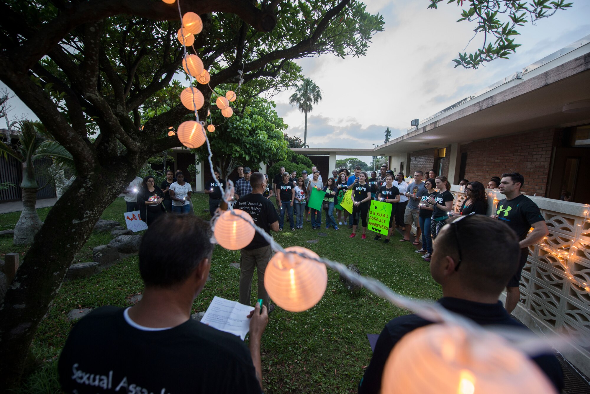 Lights illuminate the Chapel 2 courtyard after a moment of silence during Take Back the Night April 29, 2016, at Kadena Air Base, Japan. During the event mandatory reporters explained the importance of leadership reporting sexual assault and their experiences of reporting. (U.S. Air Force photo by Senior Airman Omari Bernard)
