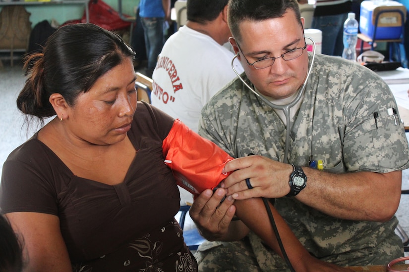 U.S. Army Corporal Kerry Holmes, Joint Task Force-Bravo Medical Element, checks a woman’s vital signs during a Medical Readiness Training Exercise in Jocotán, Chiquimula, Guatemala, April 29, 2016. As a result of this joint effort between the U.S., Honduras and Guatemala, more than 900 patients were treated during the two-day medical exercise, providing them with basic health care, preventive medicine and orientation, dental services and medication free of cost.  (U.S. Army photo by Maria Pinel)