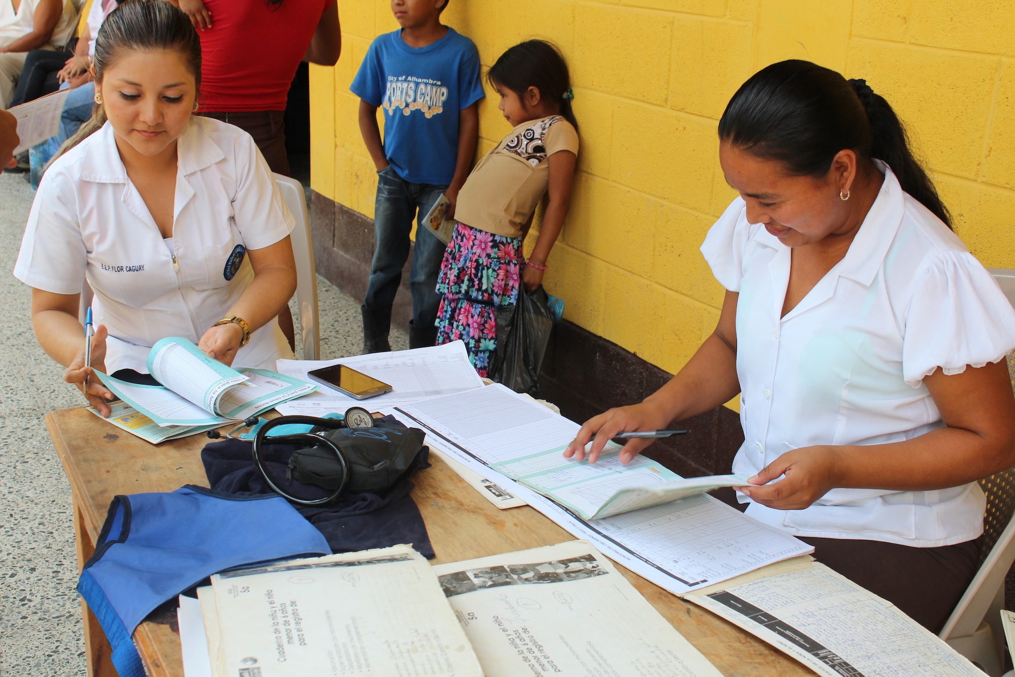 Guatemalan Public Health Services representatives check vaccination cards during a joint Medical Readiness Training Exercise at Jocotán, Chiquimula, Guatemala, April 29, 2016. MEDRETES serve to validate a service member’s ability to provide care under austere conditions in remote locations, and also provide an opportunity for them to work side by side with foreign counterparts while providing much-needed medical care, developing partnerships and long-lasting relationships with other nations. (U.S. Army photo by Maria Pinel)