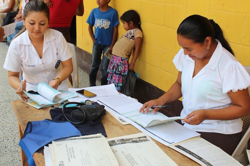 Guatemalan Public Health Services representatives check vaccination cards during a joint Medical Readiness Training Exercise at Jocotán, Chiquimula, Guatemala, April 29, 2016. MEDRETES serve to validate a service member’s ability to provide care under austere conditions in remote locations, and also provide an opportunity for them to work side by side with foreign counterparts while providing much-needed medical care, developing partnerships and long-lasting relationships with other nations. (U.S. Army photo by Maria Pinel)