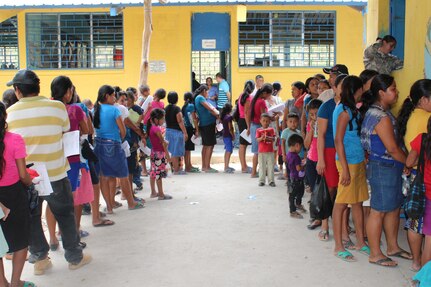 Residents of Jocotán wait outside the pharmacy area after a consultation with medical providers during a Joint Task Force-Bravo Medical Readiness Training Exercise in Jocotán, Chiquimula, Guatemala, April 29, 2016. More than 500 patients were treated in Guatemala, receiving basic health care, preventive medicine and orientation, dental services and medication free of cost.  (U.S. Army photo by Maria Pinel) 
