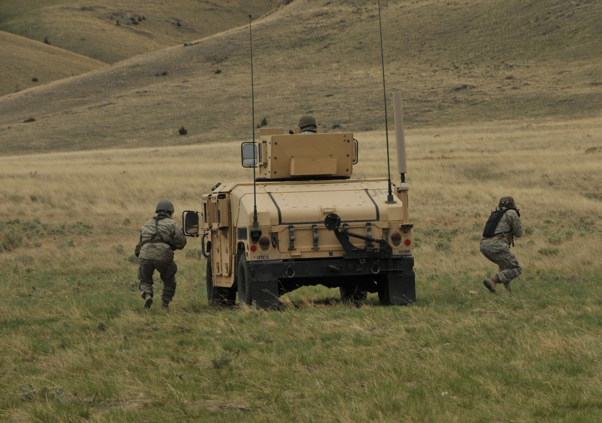 Airmen from the 120th Civil Engineer Squadron, Montana Air National Guard, engage with oppositional forces during a training exercise April 30, 2016, at Fort Harrison in Helena, Mont. Members of the 120th Mission Support Group participated in a field training exercise that tested their contingency skills in a simulated combat environment. (U.S. Air National Guard photo by Tech. Sgt. Christy Mason)