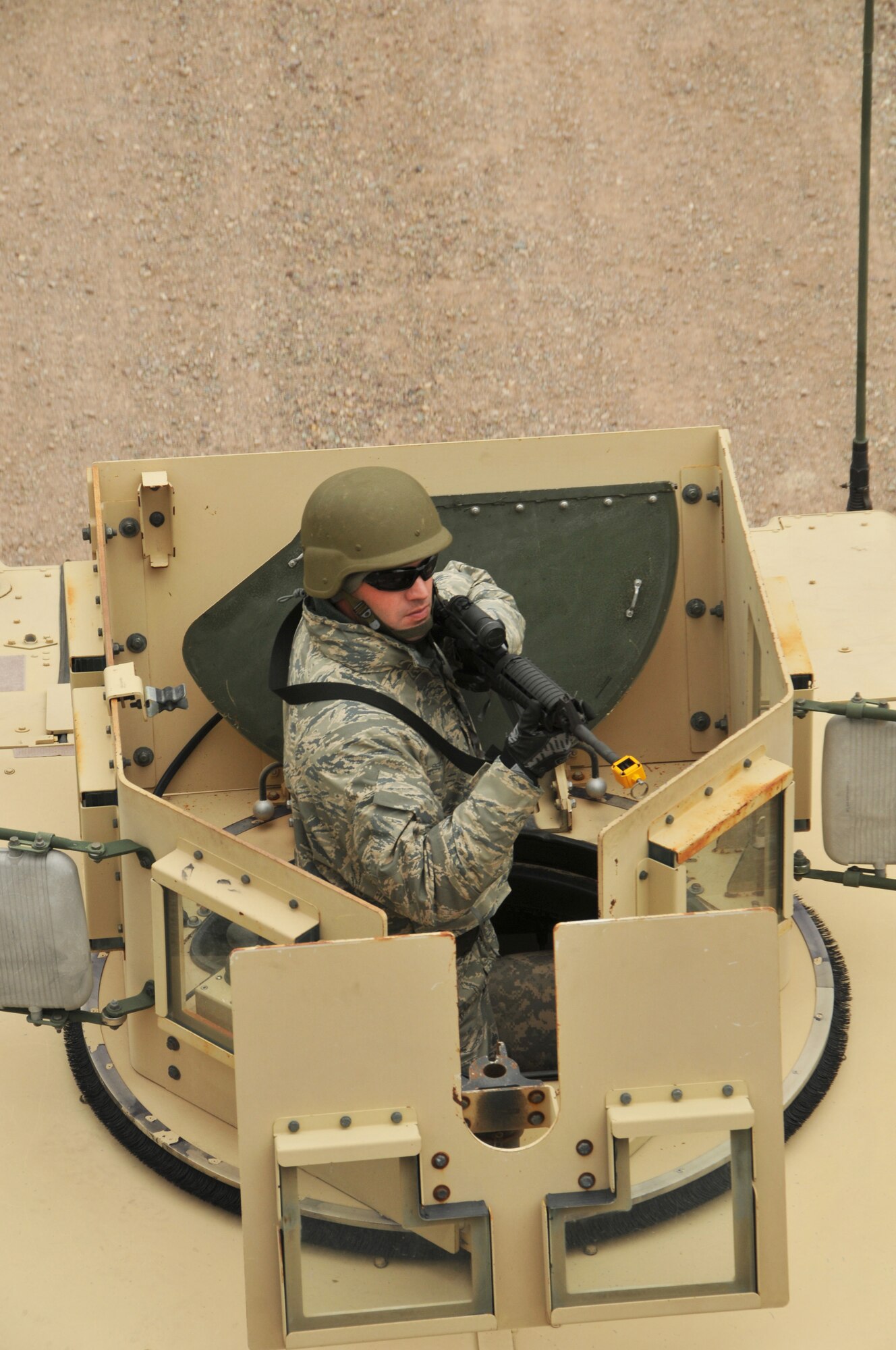 An Airman from the 120th Civil Engineer Squadron, Montana Air National Guard, provides over watch from a Humvee during convoy training April 30, 2016, at Fort Harrison in Helena, Mont. Members of the 120th Mission Support Group participated in a field training exercise that tested their contingency skills in a simulated combat environment. (U.S. Air National Guard photo by Tech. Sgt. Christy Mason)