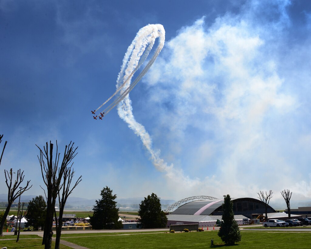 The Aeroshell Aerobatic Team, a precision AT-6 Texan flight demonstration team perform at the 2016 Smoky Mountain Air Show in Knoxville, TN. (U.S. Air National Guard photo by Master Sgt. Kendra M. Owenby, 134 ARW Public Affairs)