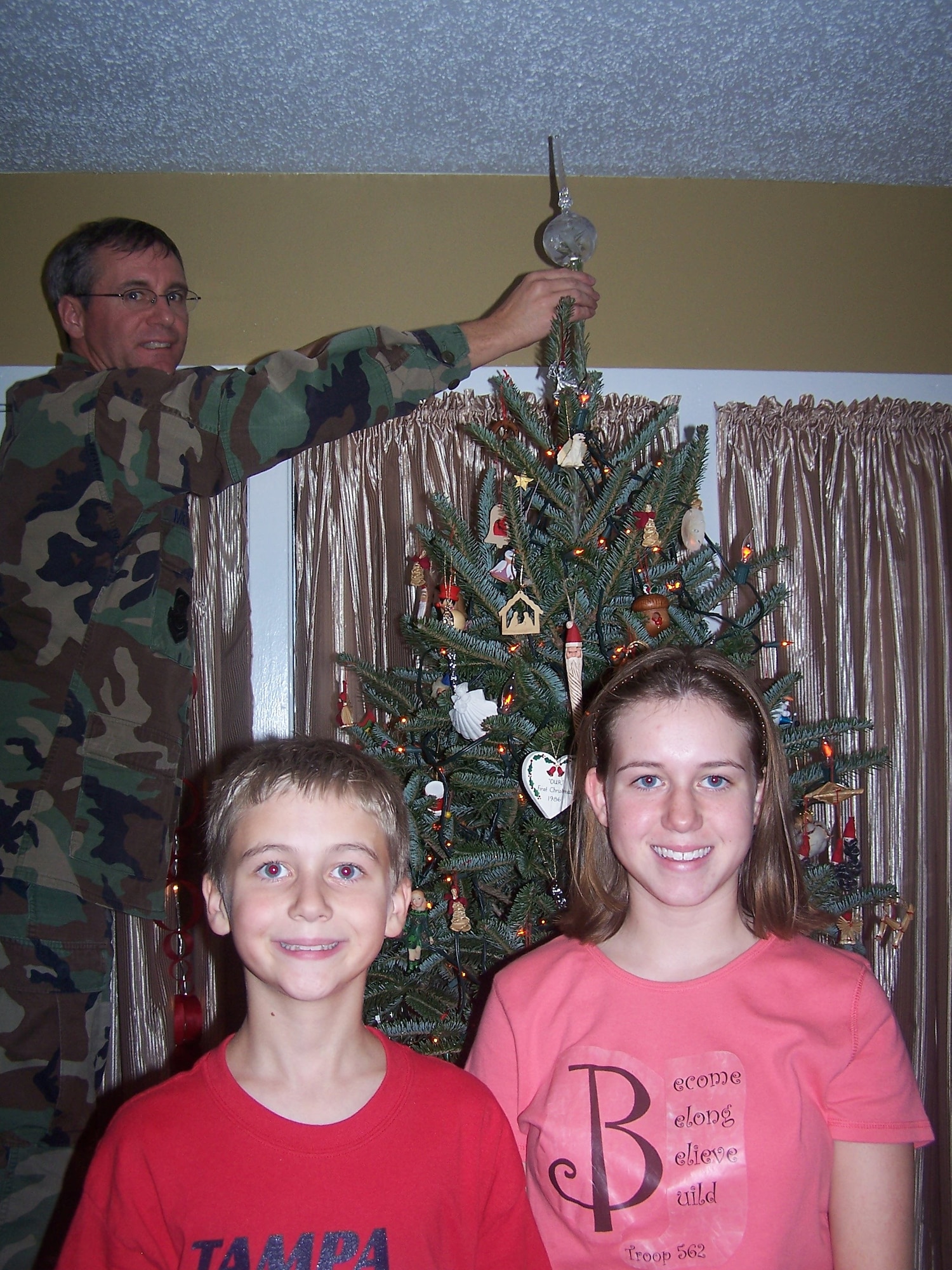 Retired Col. Robert Moriarty and his children, Ryan and Lauren, decorate for Christmas in the living room of their home at MacDill Air Force Base, Florida in December 2006. Like many military families, Moriarty missed a number of holidays with his family during his active-duty years. “The home is the heart of a family — it’s where celebrations take place and memories are made. Our Airmen and their families deserve to live and make memories in quality homes,” said Moriarty, who today serves as the Air Force Civil Engineer Center’s Installations Director and housing privatization program execution office. (Photo courtesy of the Moriarty family) 