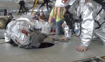 Robins Firefighter take part in confined space rescue training atop a C-130. (U.S. Air Force photo by Ray Crayton)