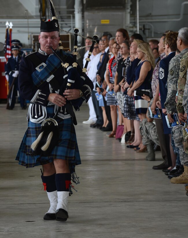 Master Sgt. Iain Morrison, 554th RED HORSE engineering flight superintendent, plays the bagpipes during the 36th Wing change of command ceremony May 6, 2016, at Andersen AFB, Guam. A change of command is a military tradition that represents a formal transfer of authority and responsibility for a unit from one commanding officer to another. (U.S. Air Force photo by Airman 1st Class Arielle Vasquez/Released)