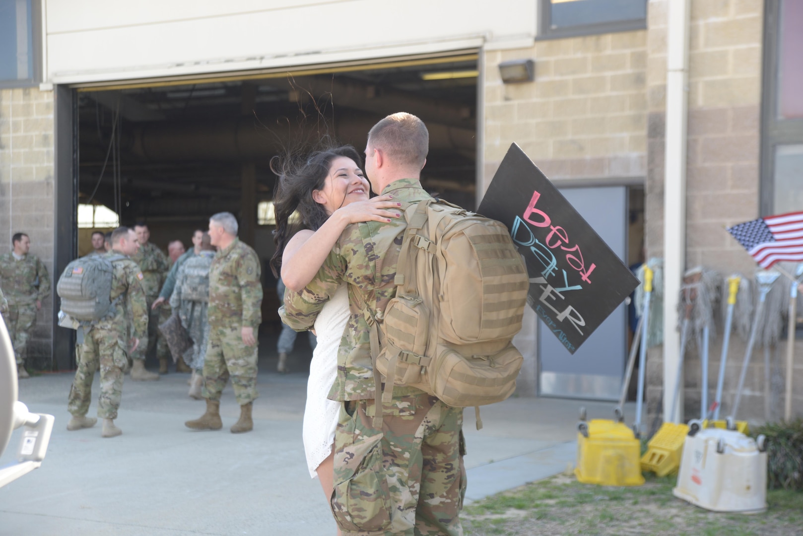 Symbolic of today's designation as Military Spouse Appreciation Day, family and friends welcome Soldiers assigned to the 1st Battalion, 252nd Armor Regiment, 30th Armored Brigade Combat Team, home with open arms after redeploying to Pope Airfield at Fort Bragg, North Carolina, March 22, 2016.