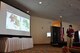 Kim Christensen, National Interagency Fire Center deputy assistant director of operations for fire and aviation management, briefs members of the Air National Guard and Air Force Reserve on the U.S.'s 2016 wildland fire outlook during day one of the 2016 Modular Airborne Fire Fighting System certification week in Ventura, Calif., May 2, 2016. The annual certification week, taking place May 2-6, brings together members of the Air National Guard and Air Force Reserve to be certified on operating MAFFS in the event of being called upon to support wildland fire containment. The wings include North Carolina's 145th AW; California's 146th AW; Wyoming's 153rd AW; and the AF Reserve's 302nd AW. Airmen from the Colombian air force were also on hand to observe how the U.S. Air Force responds to wildland fire support requests. (U.S. Air Force photo/2nd Lt. Stephen J. Collier)