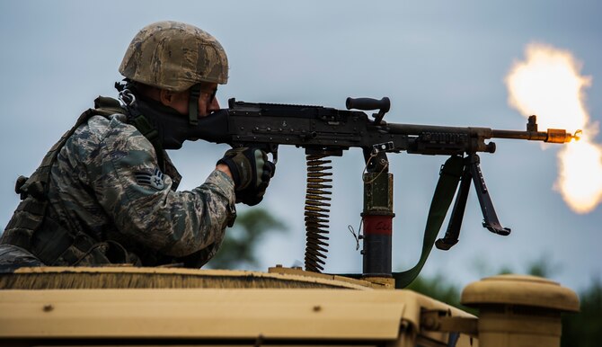 A Combat Leaders Course student provides cover-fire to a fire team during a field training exercise on Joint Base San Antonio-Camp Bullis, Texas, May 2, 2016. CLC is designed to hone the leadership skills of security forces NCOs prior to being deployed down range. The five-week course focuses on land navigation skills, mission planning and strategy. (U.S. Air Force photo/Airman 1st Class James Crow)