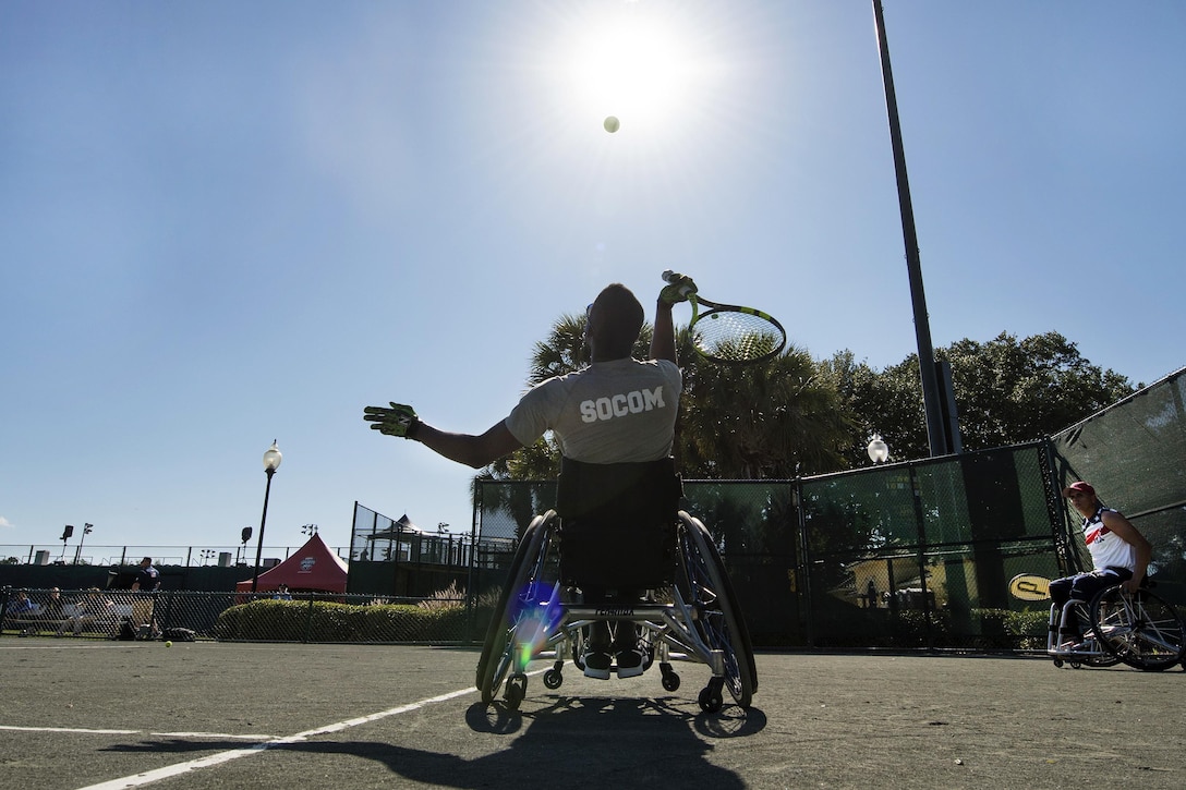 Retired Sgt. R.J. Anderson trains in the wheelchair tennis event for the 2016 Invictus Games in Orlando, Fla., May 5, 2016. Military athletes from nations around the world participate in the Invictus
Games, an international sporting event for wounded warriors to inspire recovery, support rehabilitation and generate a wider understanding and respect for those who serve their countries. DoD photo by Roger Wollenberg