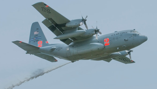 A 302nd Airlift Wing C-130 Hercules performs water-drop training in Southern California on May 3, 2016. The training was conducted at Channel Islands Air National Guard Station, Calif., for the mission’s annual certification. Since 1974, the Modular Airborne Fire Fighting System, a fire retardant delivery system inserted into a C-130, has been a joint effort including the U.S. Forest Service and the Defense Department to fight wildland fires. (Courtesy photo)