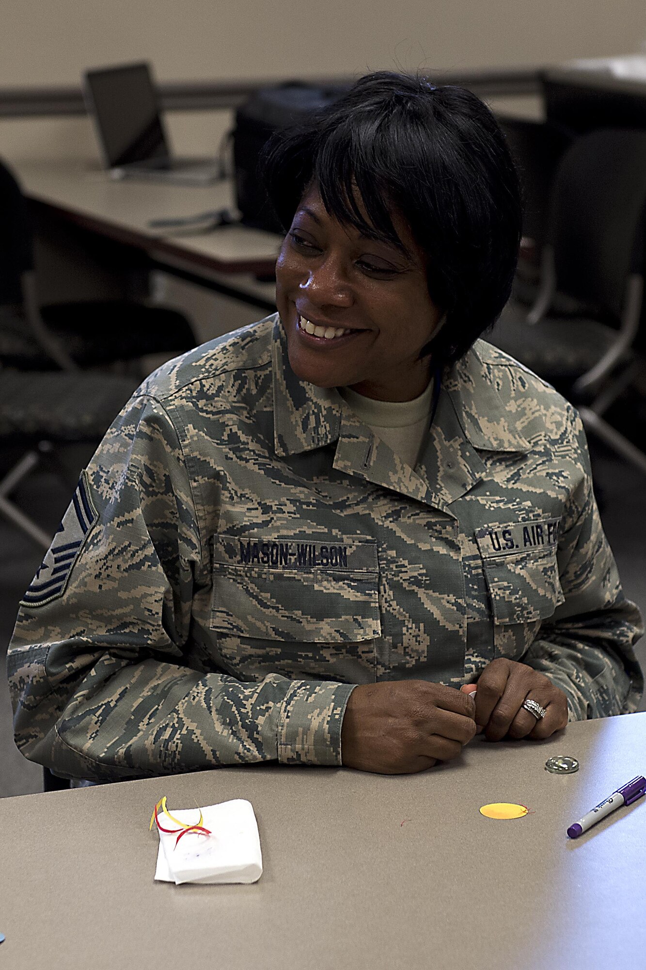 Senior Master Sgt. Linda Mason-Wilson, 434th Air Refueling Wing first sergeant, works on a touchstone during a Sexual Assault Response Coordinator art circle April 20, 2016 at Grissom Air Reserve Base, Ind. The art circle was held as part of SARC awareness month and is meant to bring people together and foster wingman attitudes. (U.S. Air Force photo/Senior Airman Dakota Bergl)