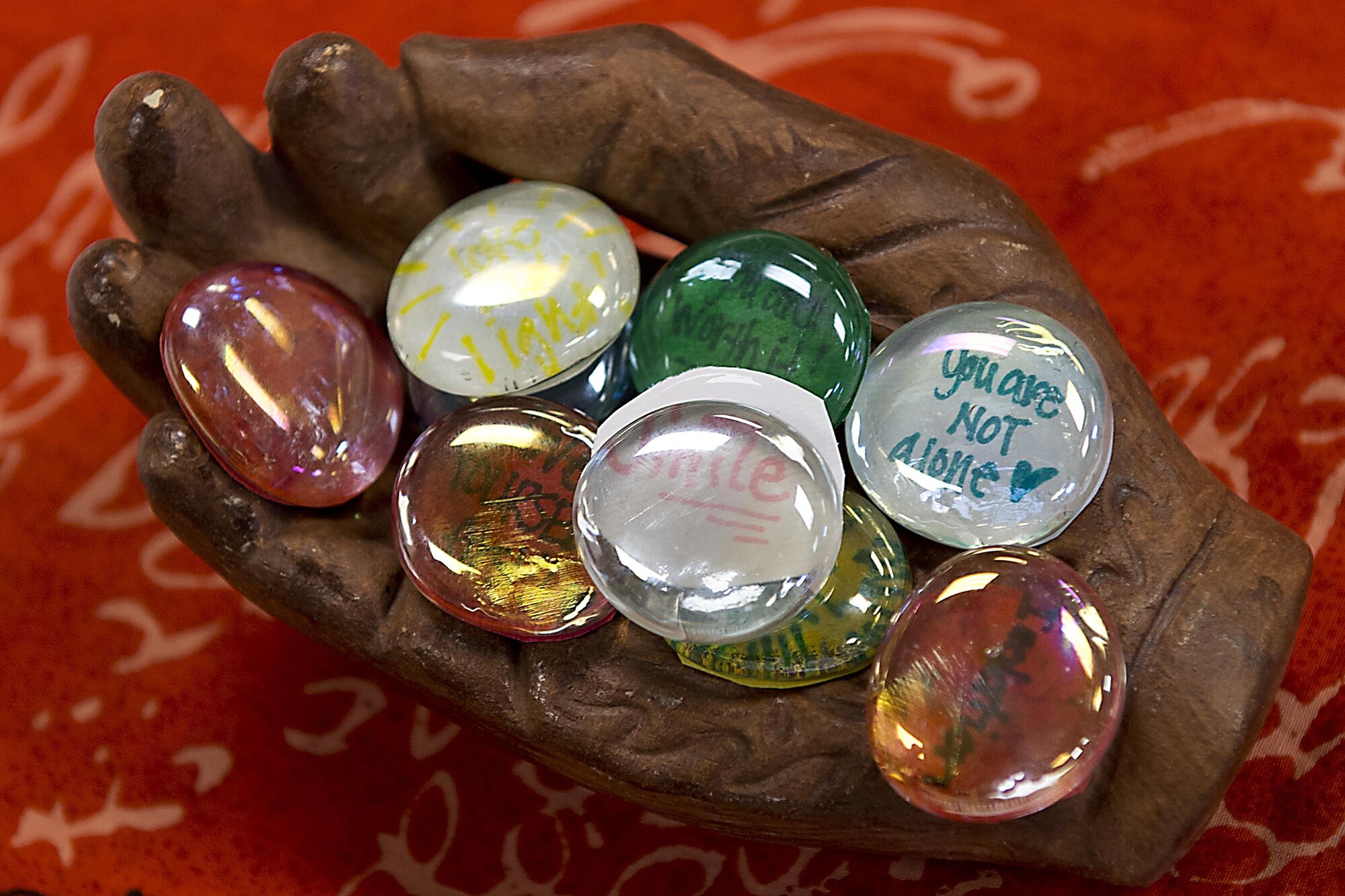 Touchstones made by Grissom personnel during a Sexual Assault Response Coordinator art circle April 20, 2016 at Grissom Air Reserve Base, Ind. are on display. Each participant was asked to make two touchstones with inspiring messages, one to keep and one to be donated to a local women’s shelter. (U.S. Air Force photo/Senior Airman Dakota Bergl)