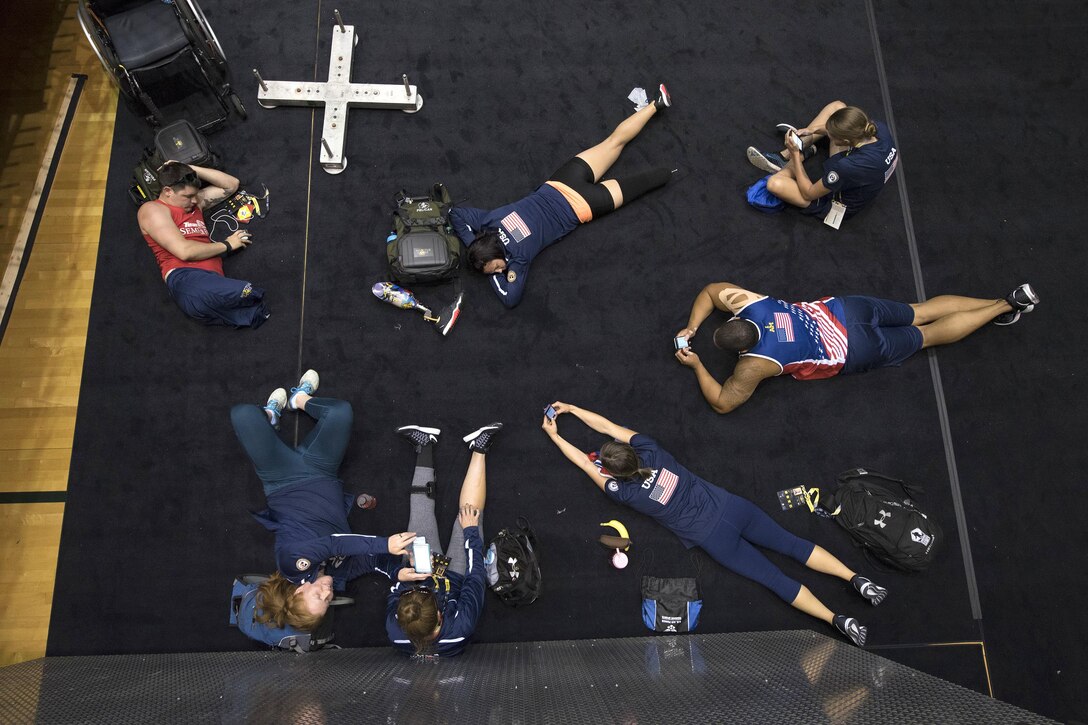 Team USA rowers take a break between sessions while training for the 2016 Invictus Games in Orlando, Fla., May 5, 2016. DoD photo by Roger Wollenberg