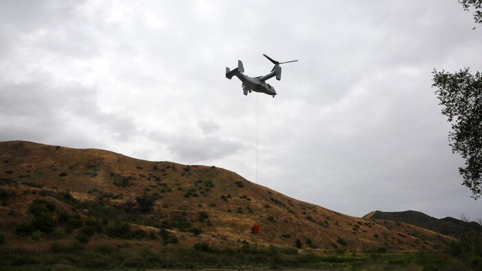 An aircraft flys over Las Pulgas Lake in California during Wildland Firefighting Exercise 2016 hosted by Marine Corps Base Camp Pendleton, May 5. The Wildland Firefighting Exercise 2016 combines elements of aviation and ground units from Marine Corps Base Camp Pendleton, 3rd Marine Air Wing, Navy Region Southwest, The California Department of Forestry and Fire Protection, and the San Diego's Sheriff's Department.