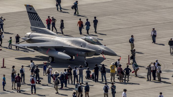 Japanese locals view static displays of various aircraft from U.S. Marine Corps’ III Marine Expeditionary Force and U.S. forces in Korea during Friendship Day at Marine Corps Air Station Iwakuni, Japan, May 5, 2016. MCAS Iwakuni's aviation friends with the Aircraft Owners and Pilots Association Japan offered displays, which included such classics as WACO biplanes.